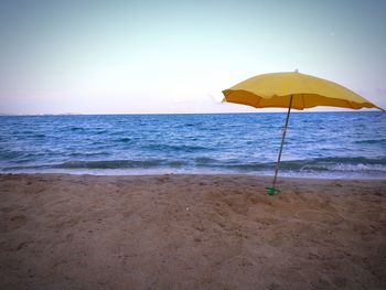 Scenic view of beach against clear sky