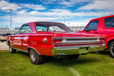 Vintage car against cloudy sky