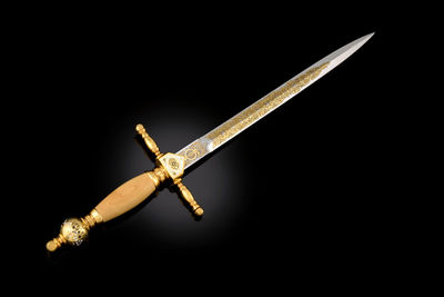 Close-up of windmill against black background