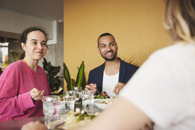 Friends eating lunch in restaurant