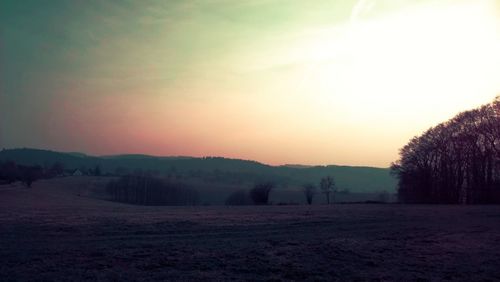 Scenic view of landscape against sky during sunset