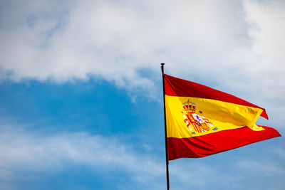 Low angle view of flag against sky