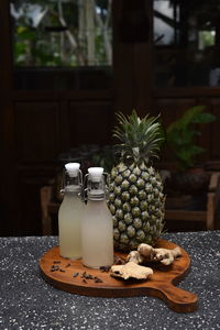 Close-up of fruit and drink on table