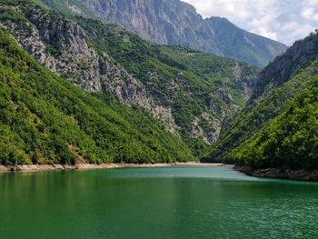 Scenic view of lake by mountains