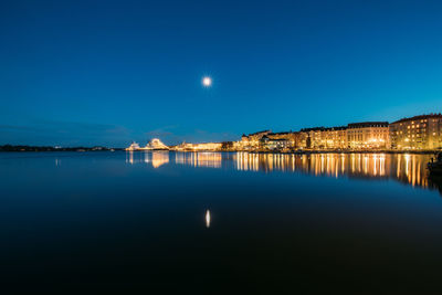 Scenic view of sea against clear sky at night