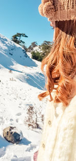 Rear view of woman in winter