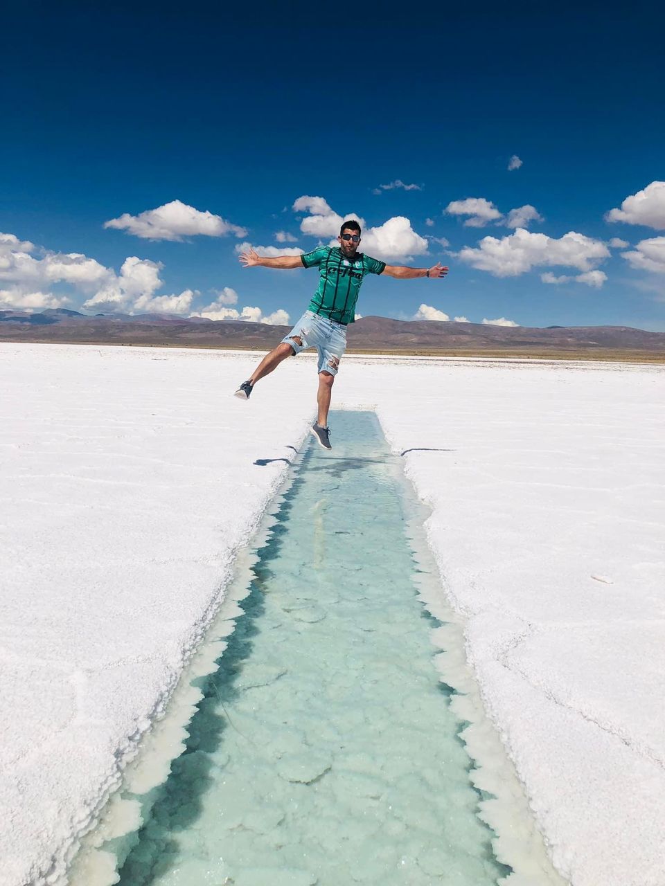 full length, snow, one person, sky, nature, winter, sea, blue, cloud, land, leisure activity, adult, day, ocean, water, environment, holiday, landscape, vacation, sports, trip, sand, travel, cold temperature, scenics - nature, outdoors, limb, travel destinations, sunlight, arm, motion, mountain, women, salt flat, sunny, fun, wave, lifestyles, standing, young adult, beach, front view, beauty in nature, casual clothing, winter sports, men, copy space, clothing, emotion, child, balance, happiness, ice