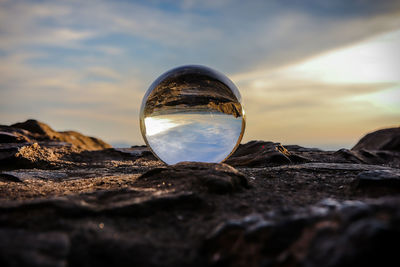 Close-up of crystal ball on rock