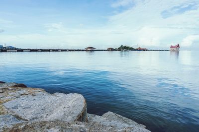 Scenic view of sea against cloudy sky