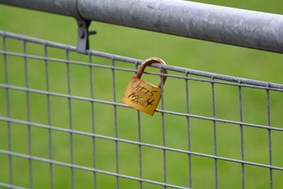 Close-up of padlock on railing