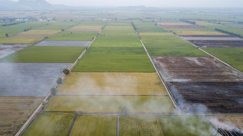 Aerial view of agricultural field against sky