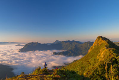 Scenic view of mountains against clear sky during sunset