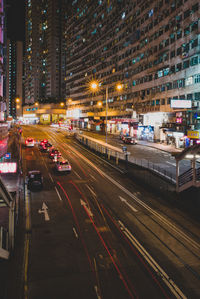 High angle view of city street and buildings at night