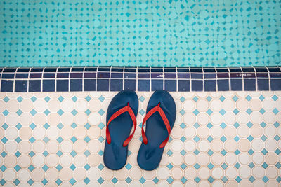 High angle view of shoes on swimming pool