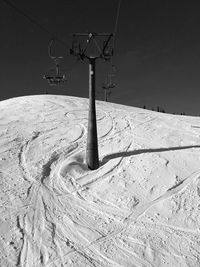 Snow covered land against sky