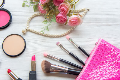 High angle view of pink flower on table