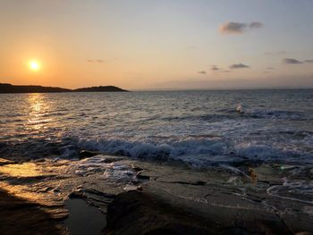 Scenic view of sea against sky during sunset