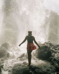 Full length of man standing in sea