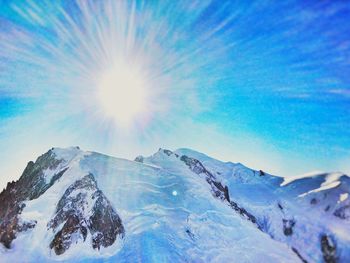 Scenic view of snow mountains against sky