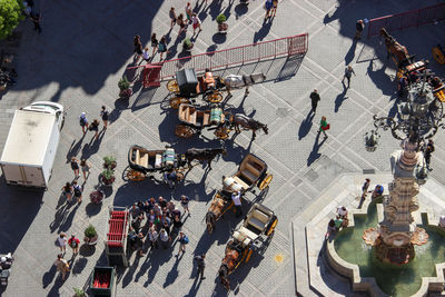 High angle view of people walking on city street