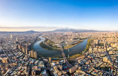 High angle view of city buildings against sky