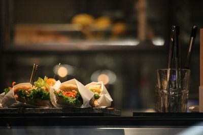 Close-up of burgers on table