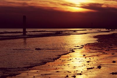 Scenic view of beach against sky during sunset