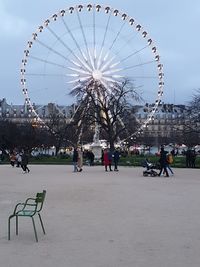 Ferris wheel in park against sky