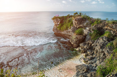 Beautiful landscape of the island of bali. a rock that goes out to sea