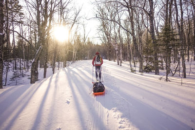 Man on snow covered land