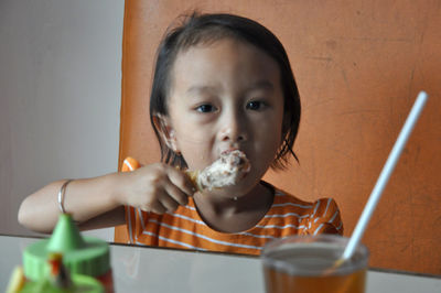 Portrait of girl eating ice cream