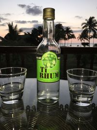 Close-up of glass bottle with water on table