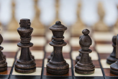 Close-up of chess pieces on white background