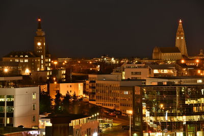 Illuminated buildings in city at night