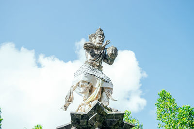 Low angle view of statue against sky