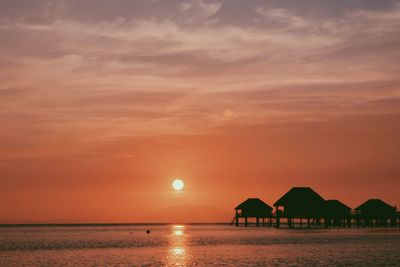 Scenic view of sea against romantic sky during sunset