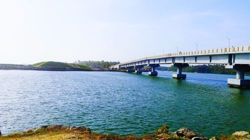 Bridge over river against clear sky