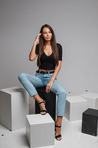 Portrait of young woman sitting outdoors