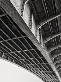 Low angle view of modern bridge in city