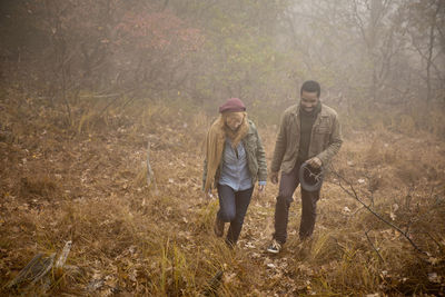 Friends walking in forest