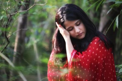 Beautiful young woman in a forest