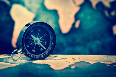 Close-up of compass on table