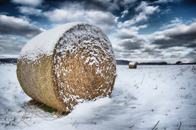 Snow on field against sky