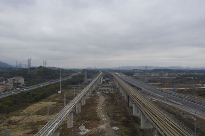 High angle view of railroad tracks in city against sky