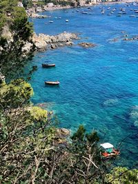 High angle view of boats on sea shore