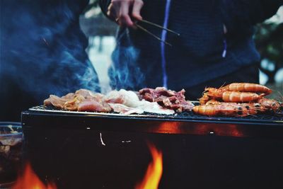 Close-up of meat cooking on barbecue grill