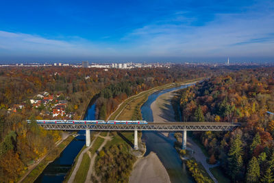 High angle view of bridge over road against blue sky