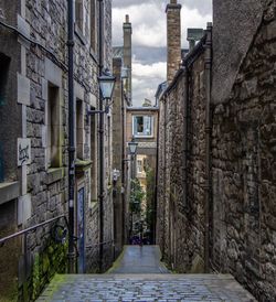 Narrow alley amidst buildings in edinburgh city