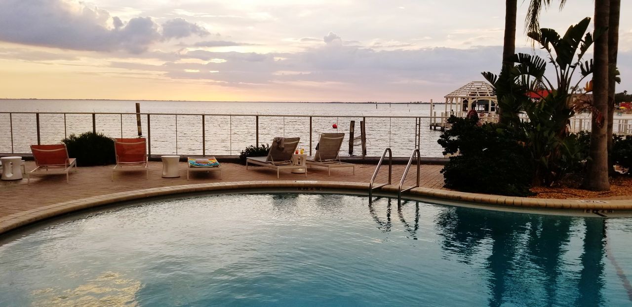 SWIMMING POOL AGAINST SKY DURING SUNSET