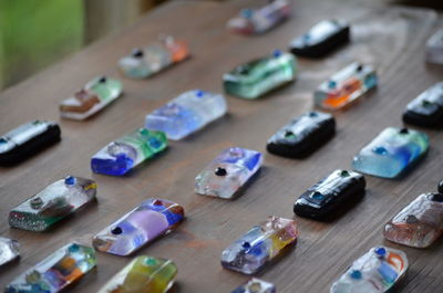 High angle view of colorful crystals arranged on table